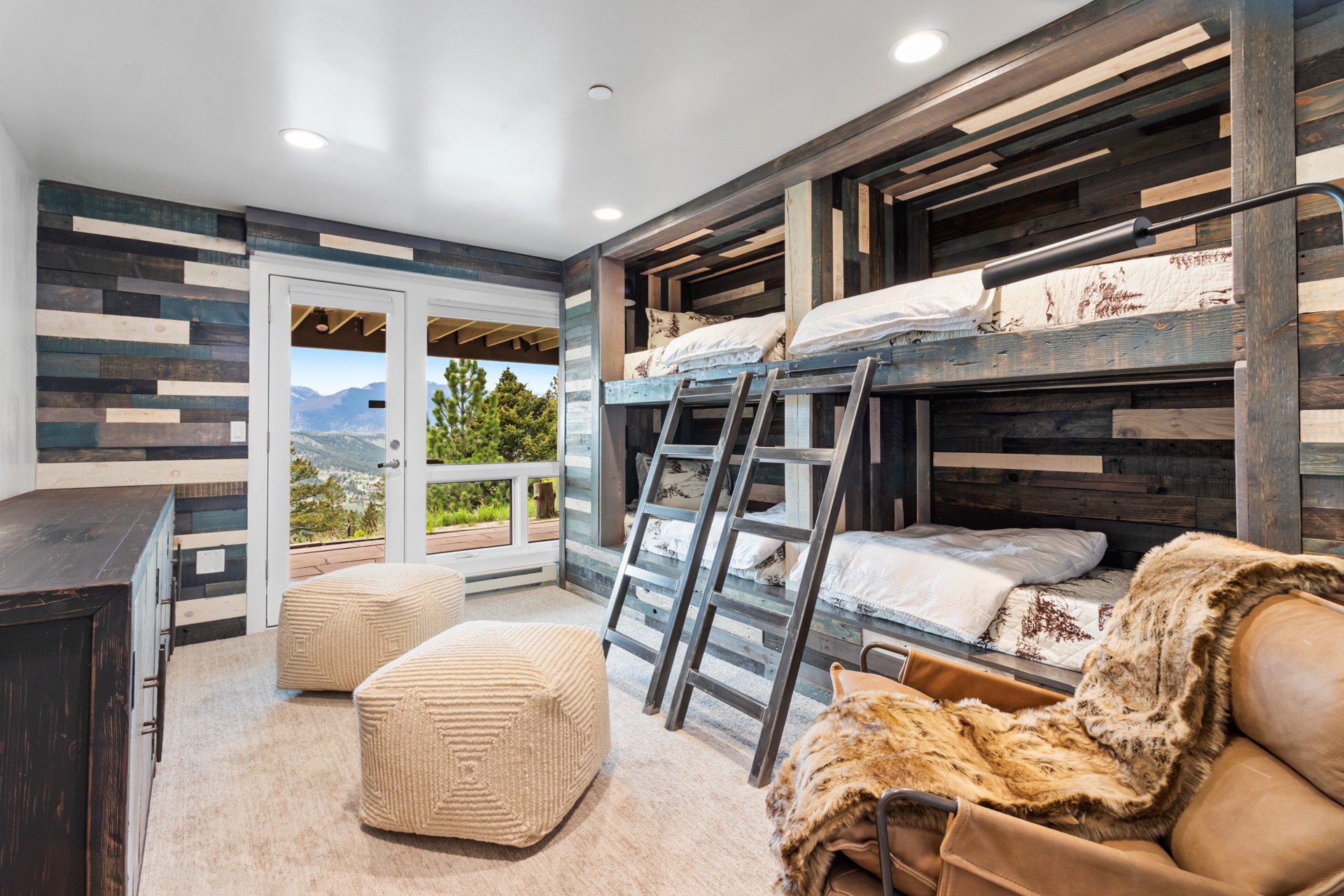 Bunk room with four built-in bunks and mountain views