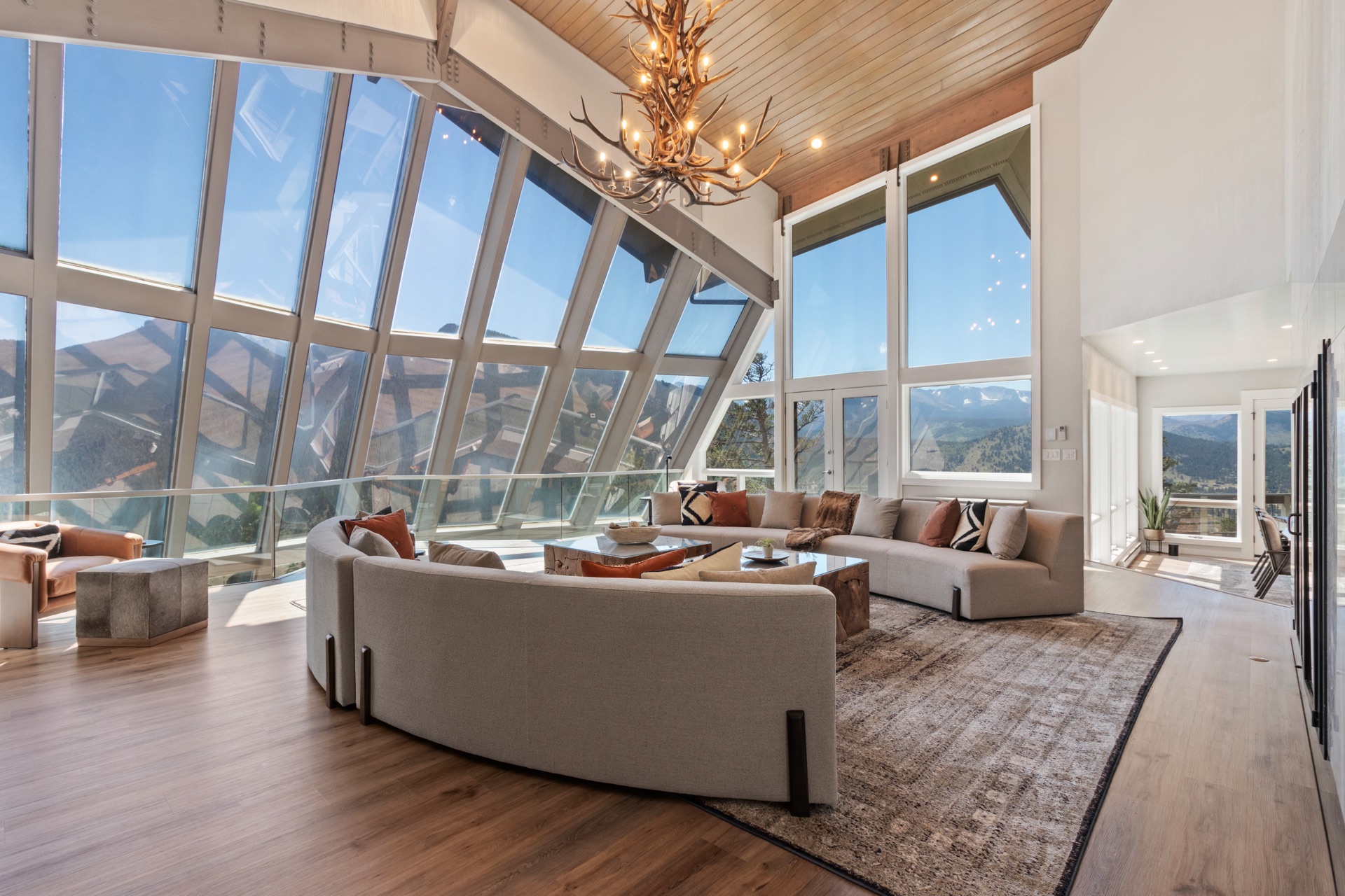 Expansive living room with panoramic views of the Rockies