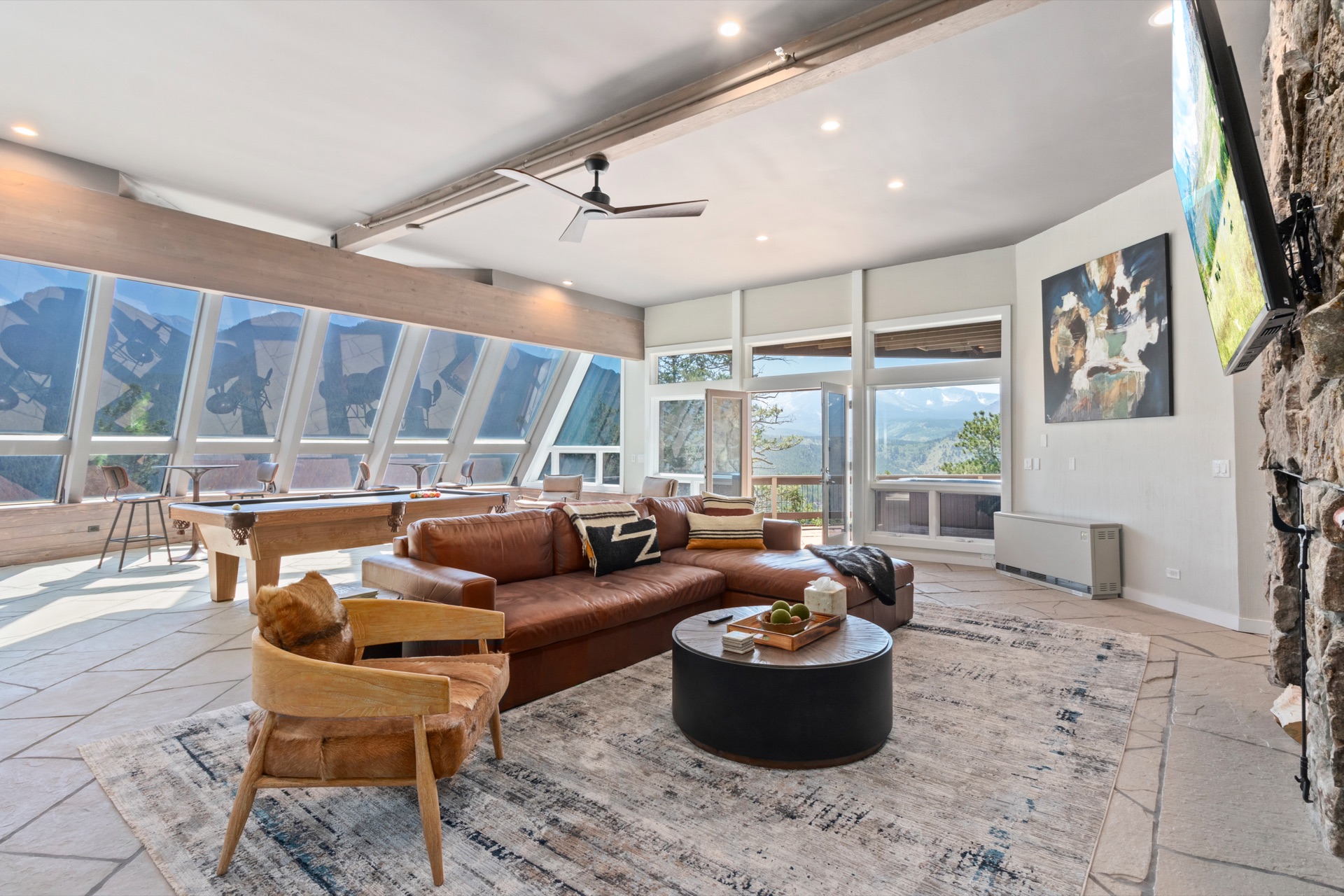 Living room interior with natural light streaming through glass