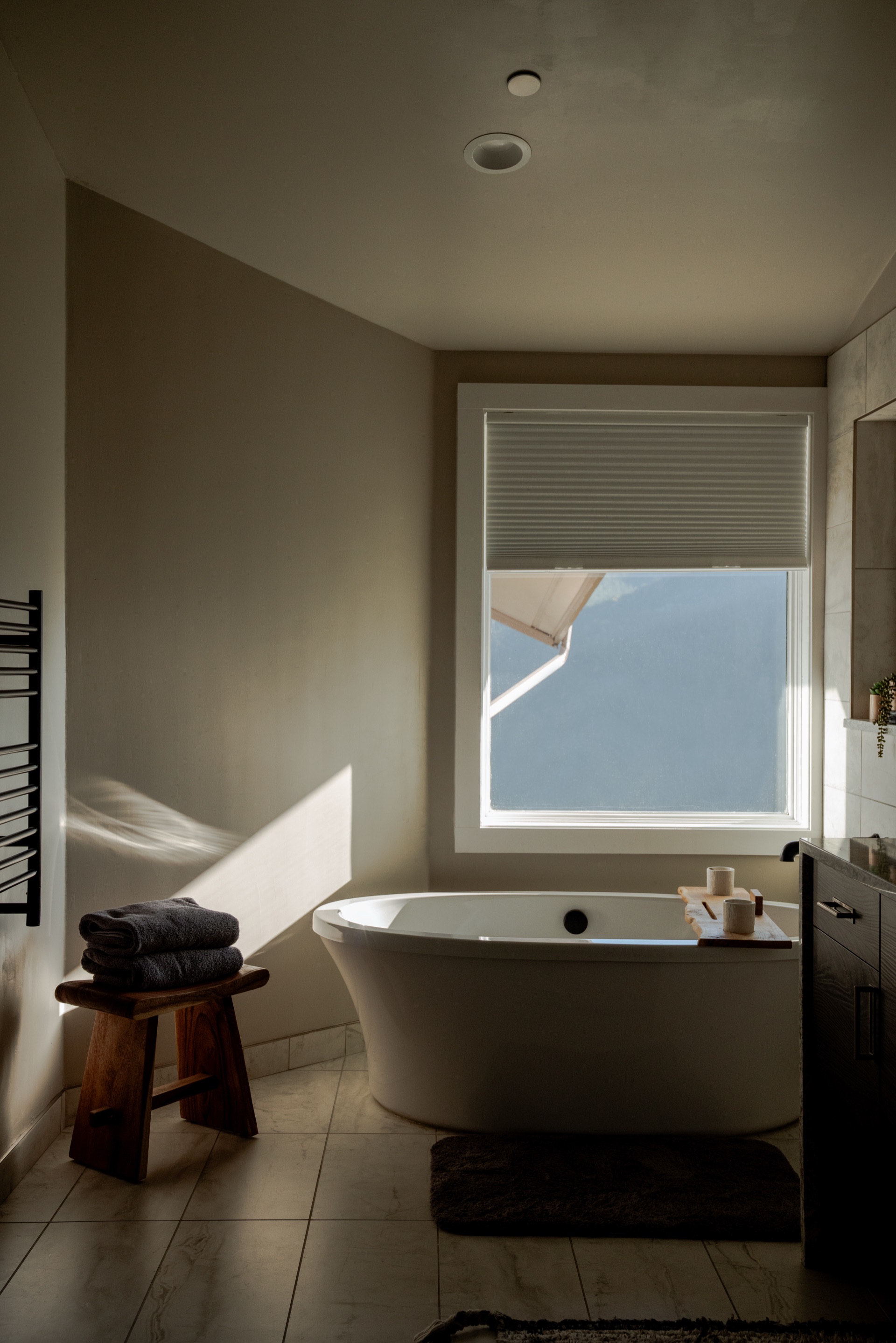 Master bathroom with soaking tub and modern fixtures