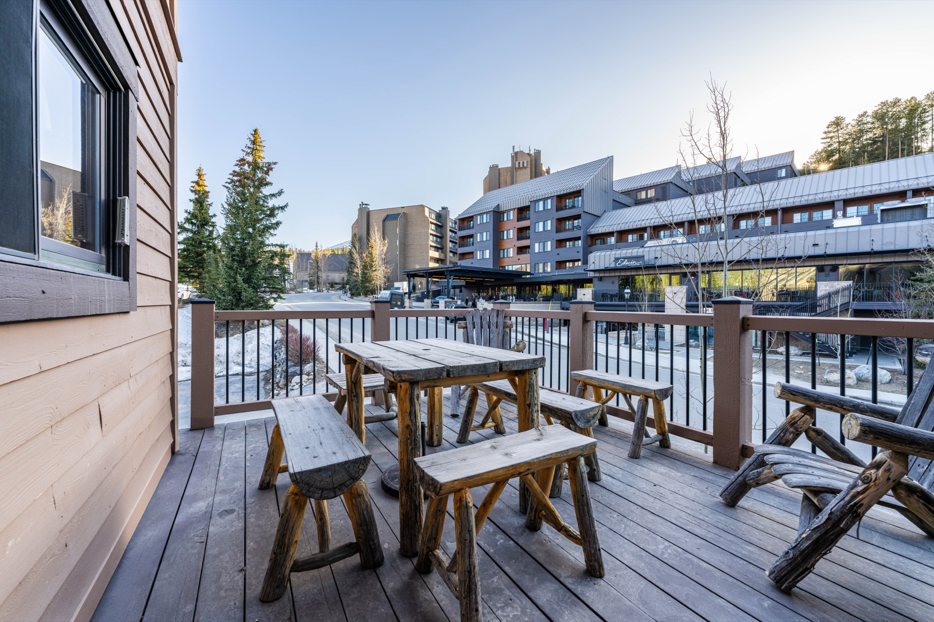 Cedars 42 deck with rustic picnic furniture and mountain views in winter