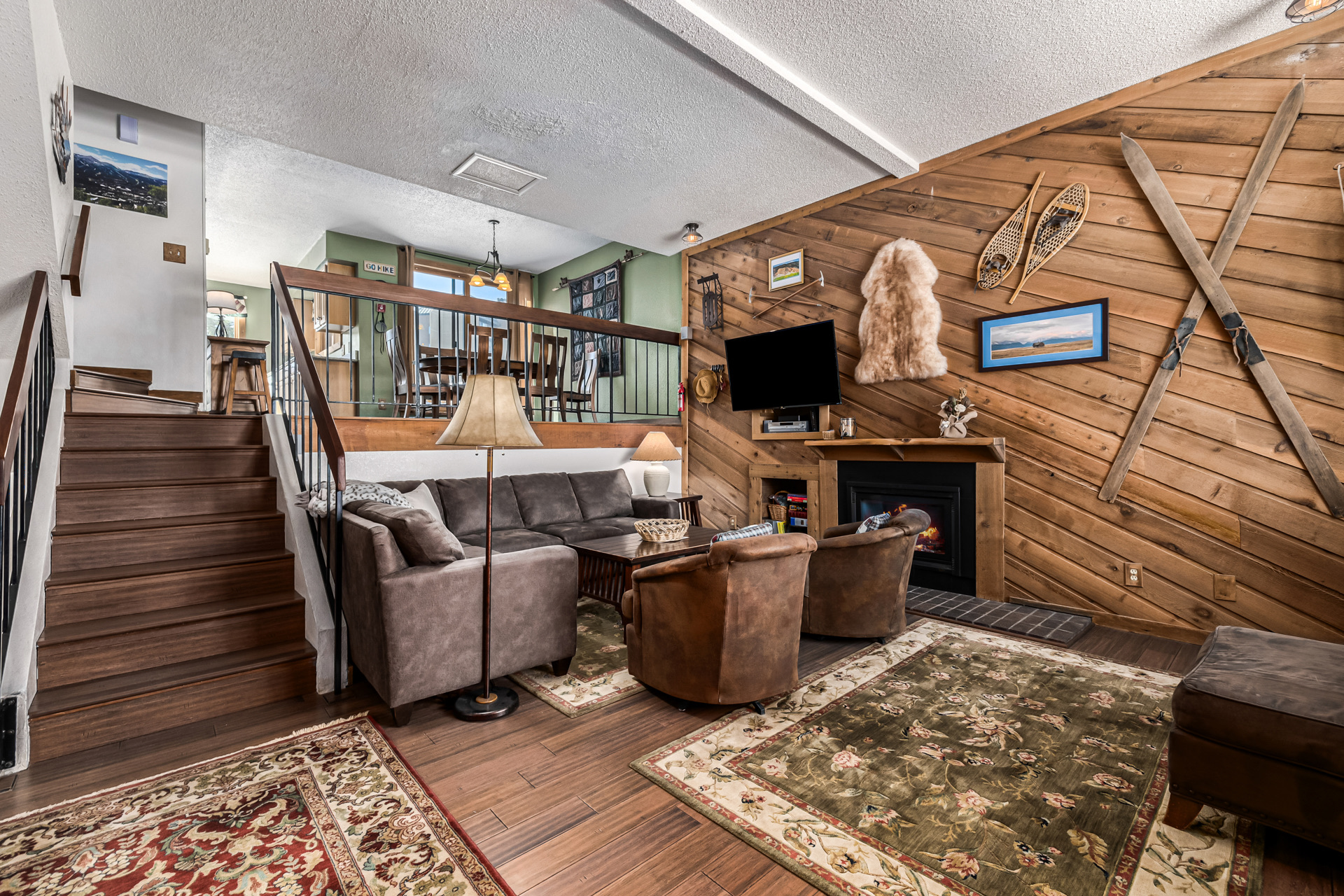 Living room with staircase and open-plan layout