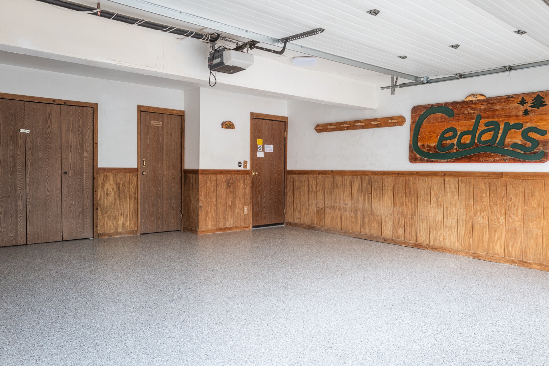 Garage interior with Cedars sign and storage