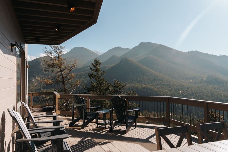 Deck with Adirondack chairs and 360-degree mountain panorama