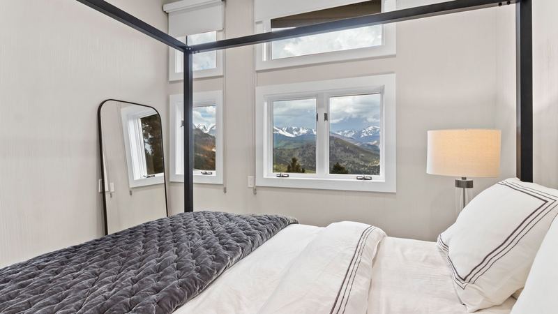 Main level queen bedroom with a mountain view